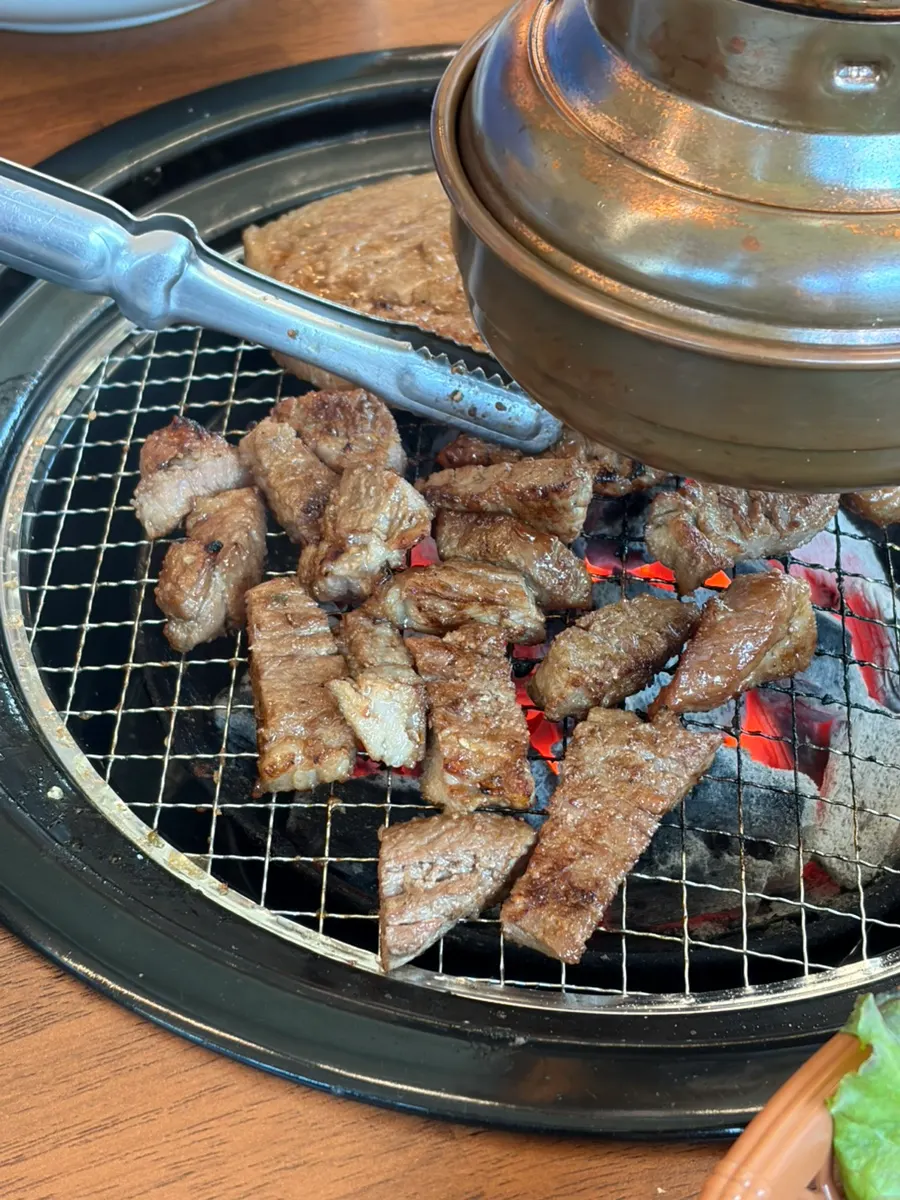 A bite-sized piece of grilled seasoned pork galbi