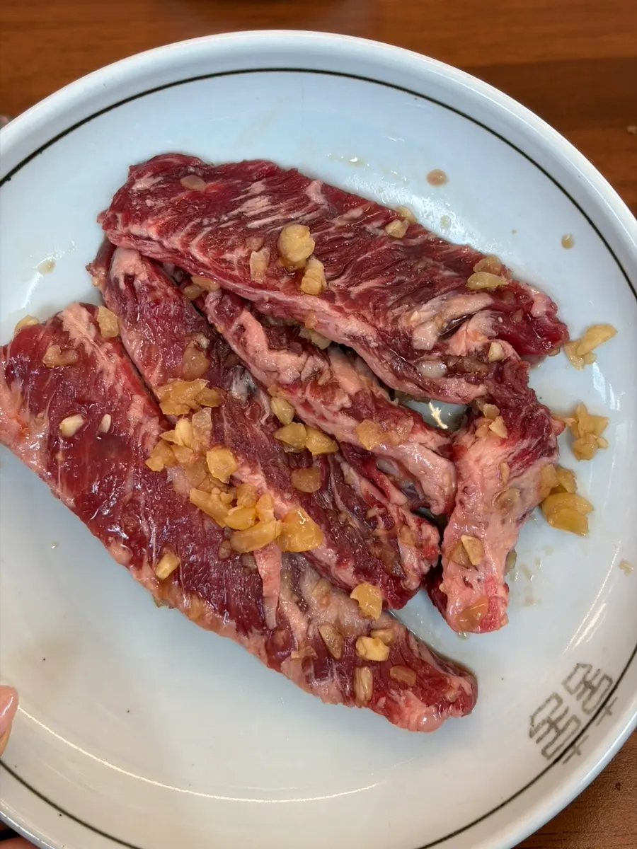 Picking up a piece of grilled pork galbi