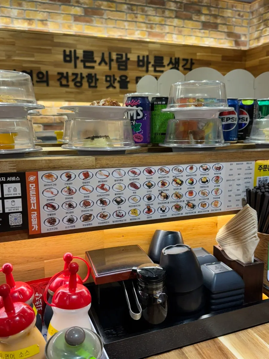 Conveyor-belt sushi moving along the rail