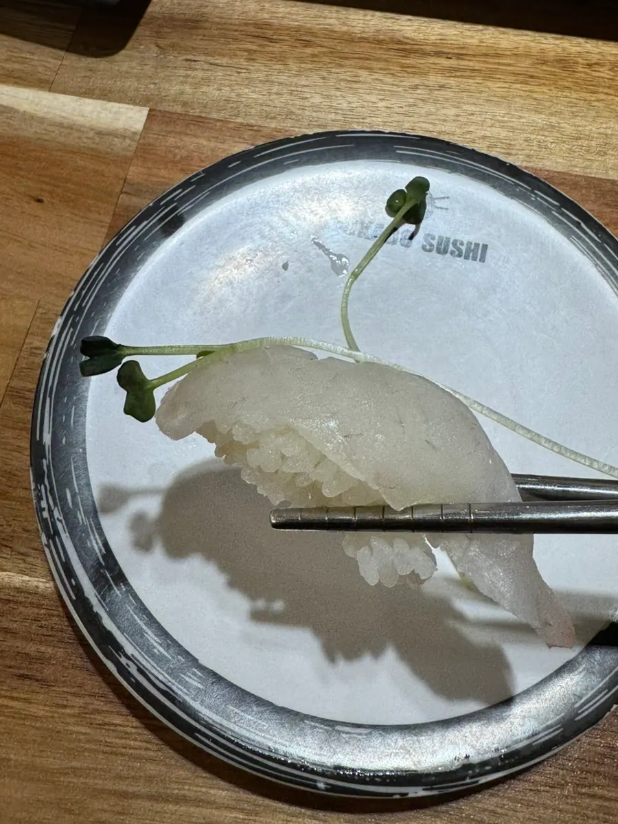 A sushi plate with fish and seared items