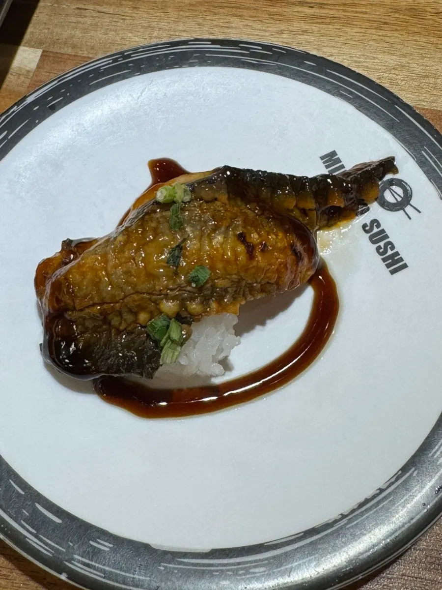 A plate of white fish sushi