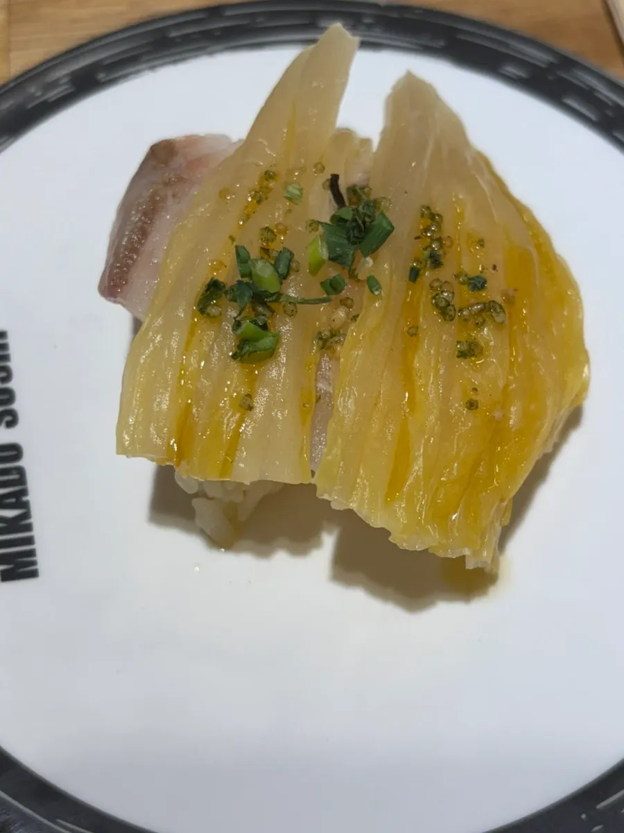 Three plates of salmon sushi
