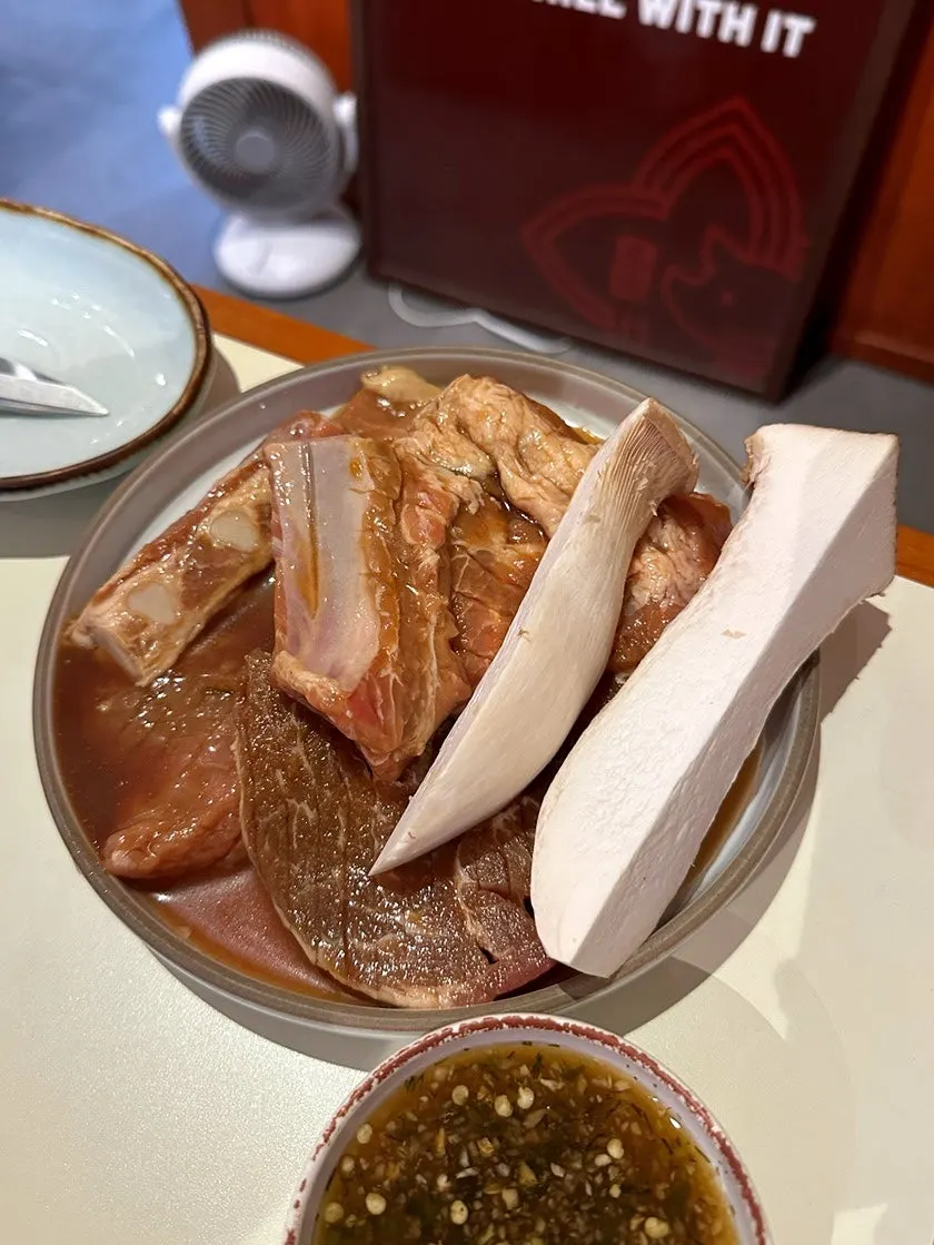 Two servings of yuzu-aged pork galbi as ordered