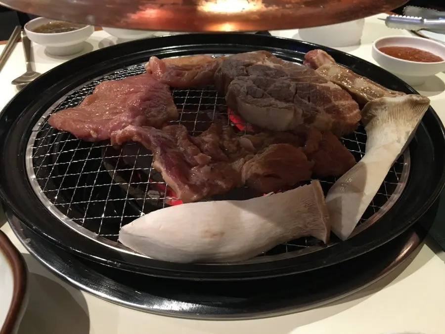 Staff grilling the pork galbi directly
