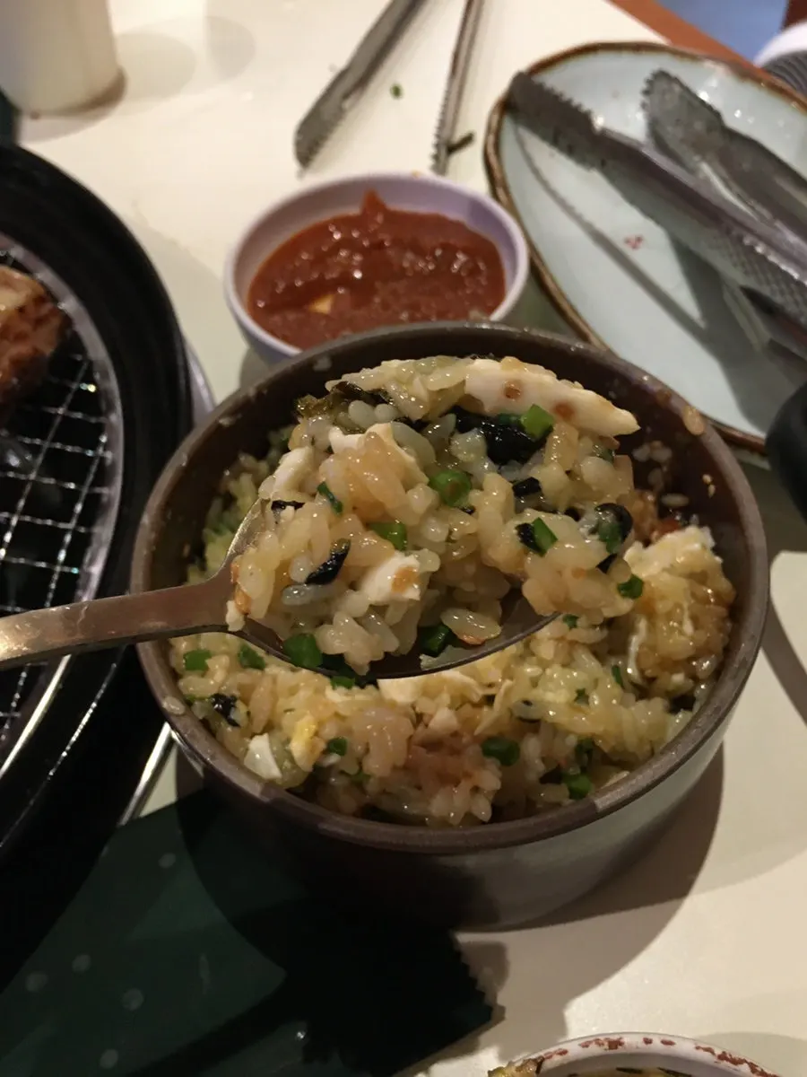 Close-up of the tarae soy sauce egg rice being mixed