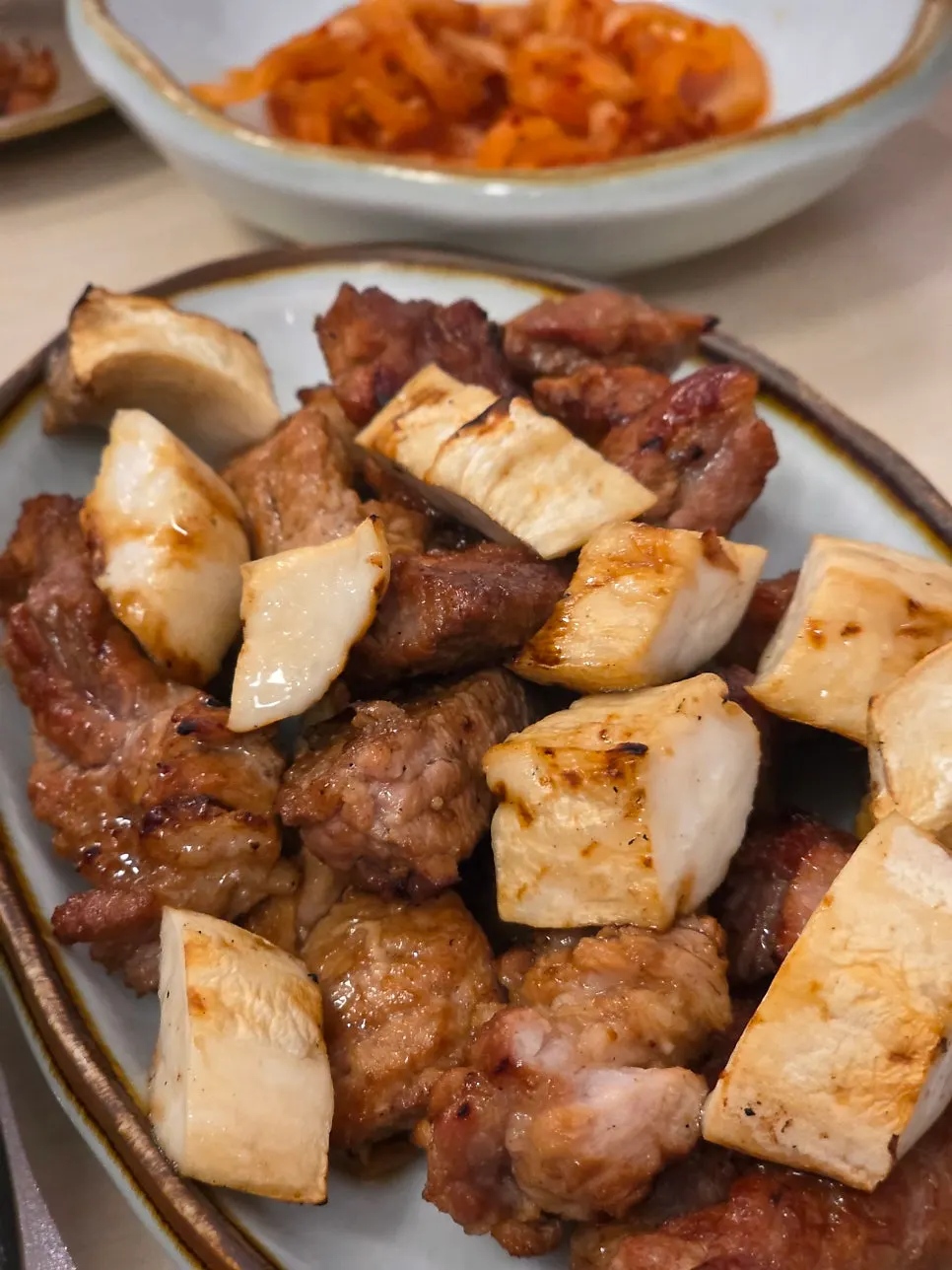 Aged black pork seasoned galbi served with side dishes