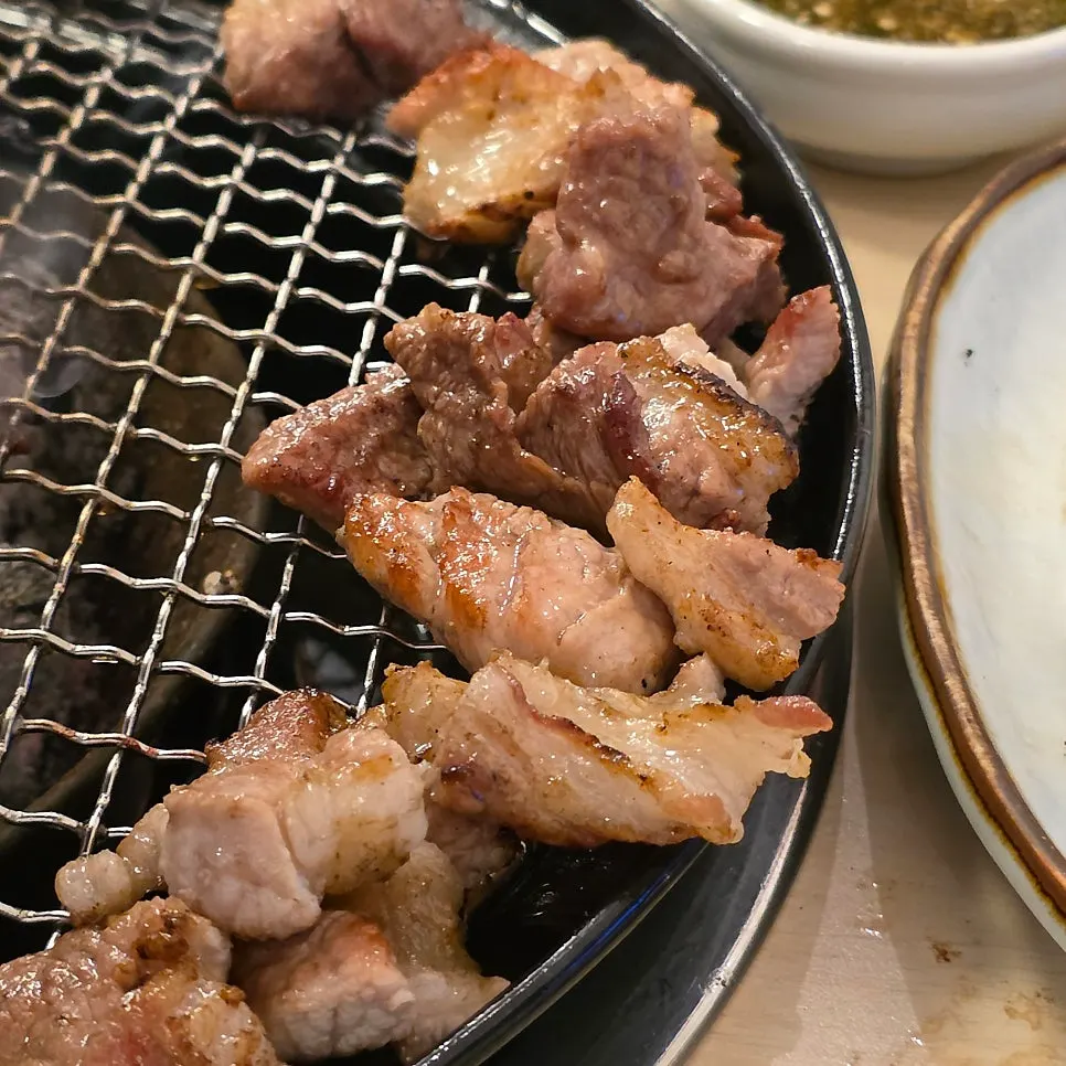Raw black pork galbi dipped in yuzu salt
