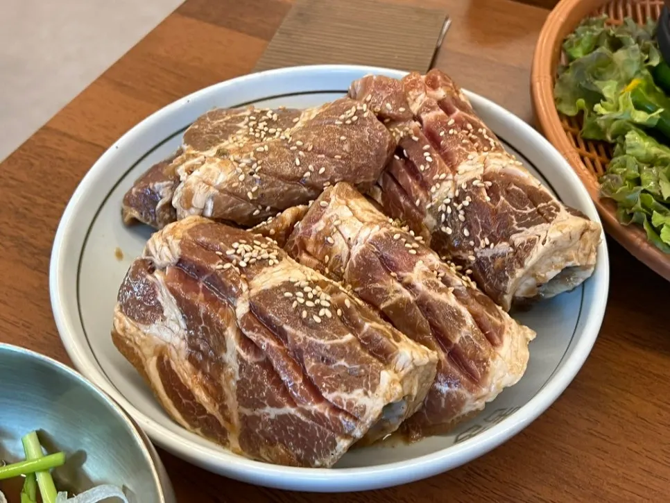 Plate of thick raw marinated pork galbi