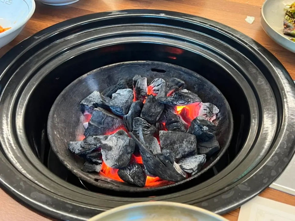 Heated charcoal grill