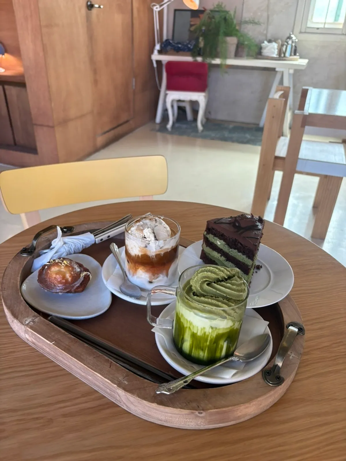 Display case of madeleines, financiers, and canelés at Cafe Pomun