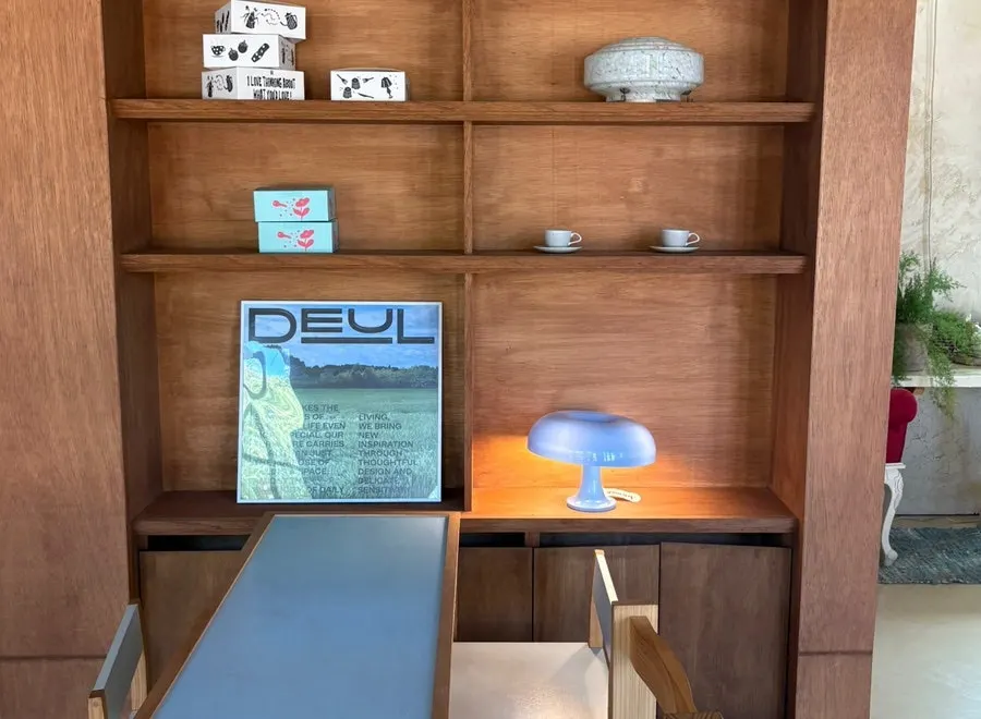 Wood-toned furniture and high ceilings inside Cafe Pomun's annex