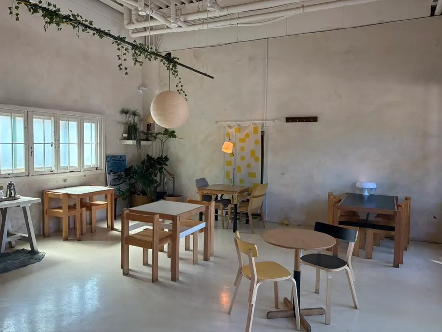 Large windows and open interior of Cafe Pomun's annex