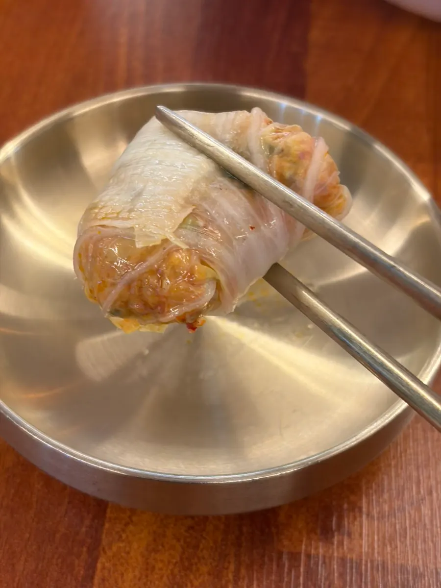 Dumpling lifted with chopsticks