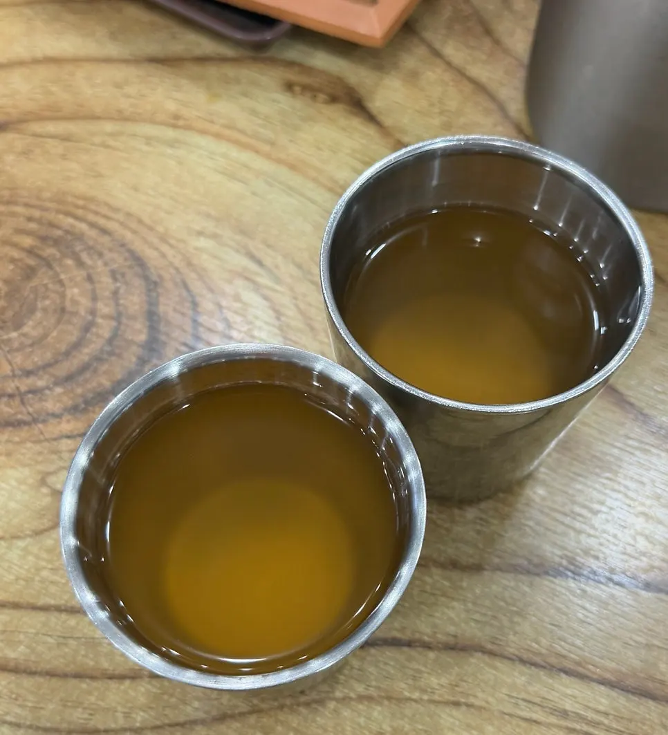 Warm broth poured into a cup at Seoul Myeonok