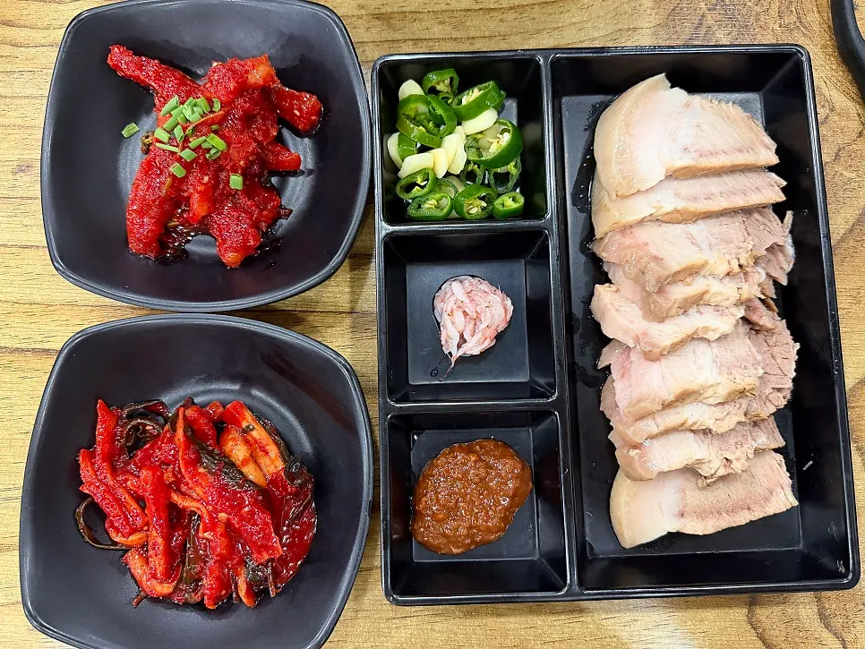 Half plate of domestic pork belly boiled pork with side dishes