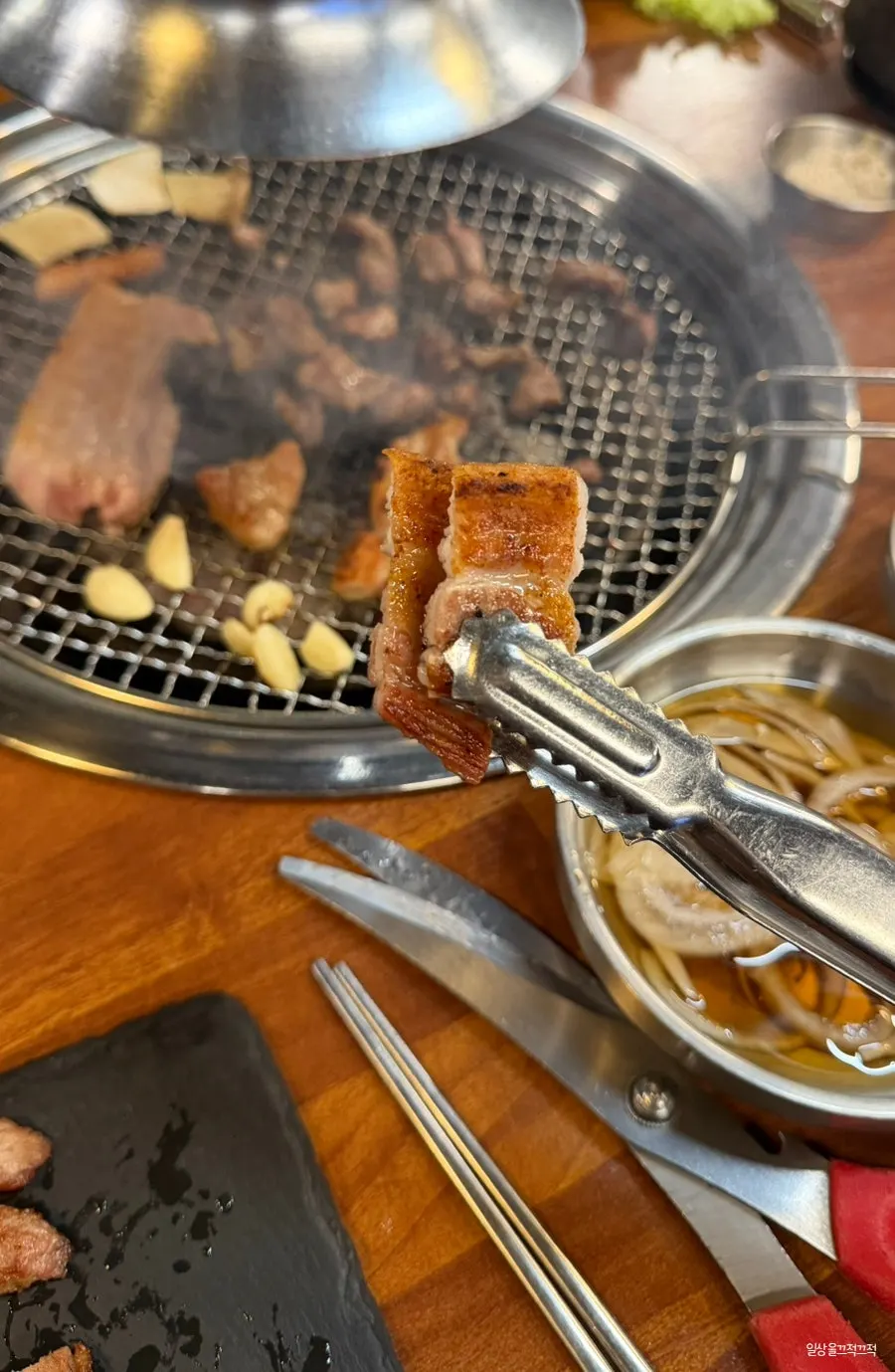 A piece of pork belly dipped in salt