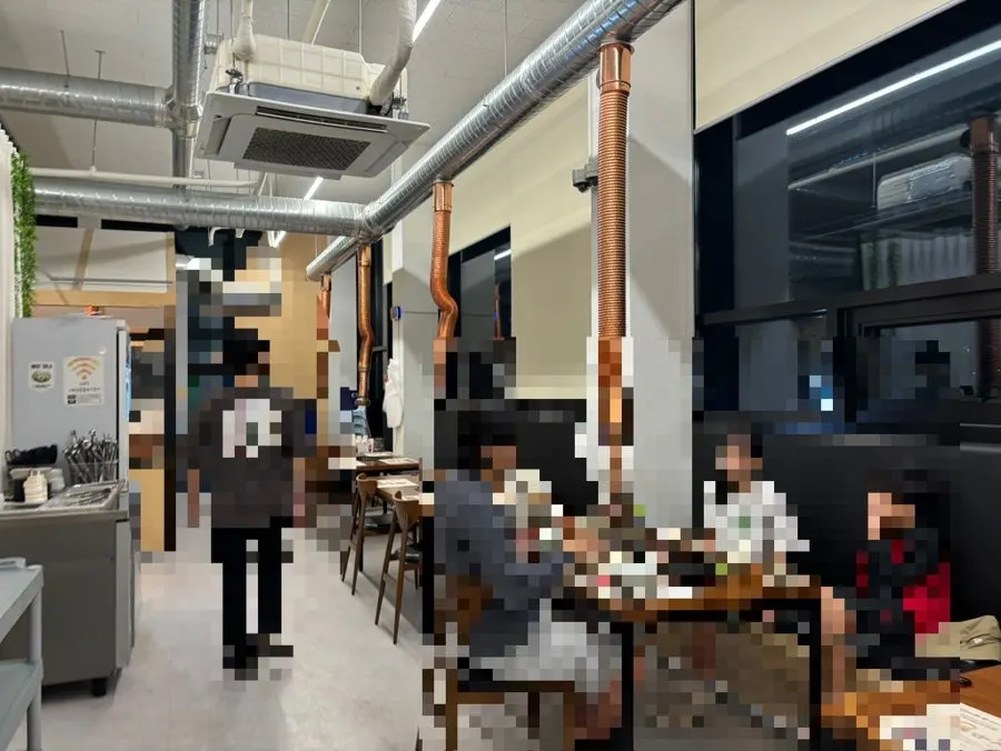 Dining hall with 4-person tables and large group tables