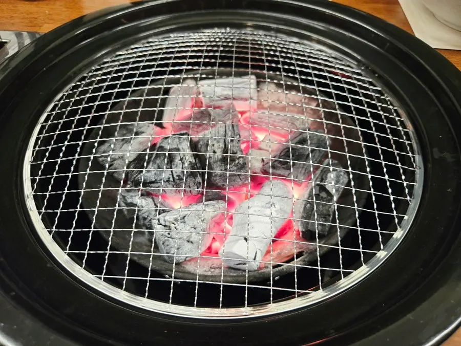 Table set with real charcoal brazier and grill plate