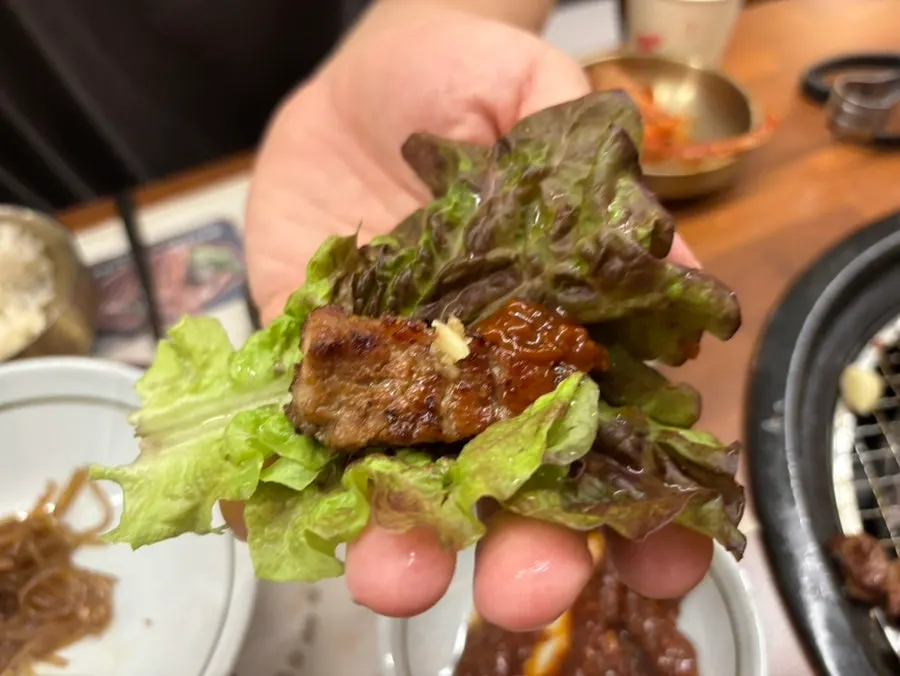 Golden, well-grilled pork galbi with a bowl of rice
