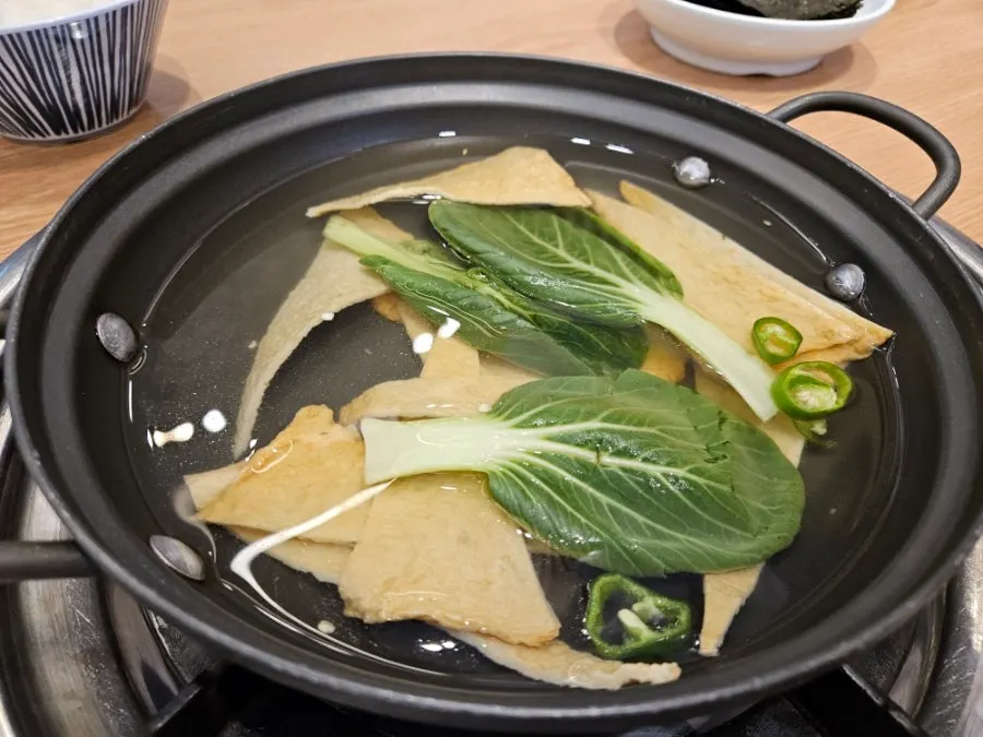 Full spread of cockle dishes and side dishes from the Family Set