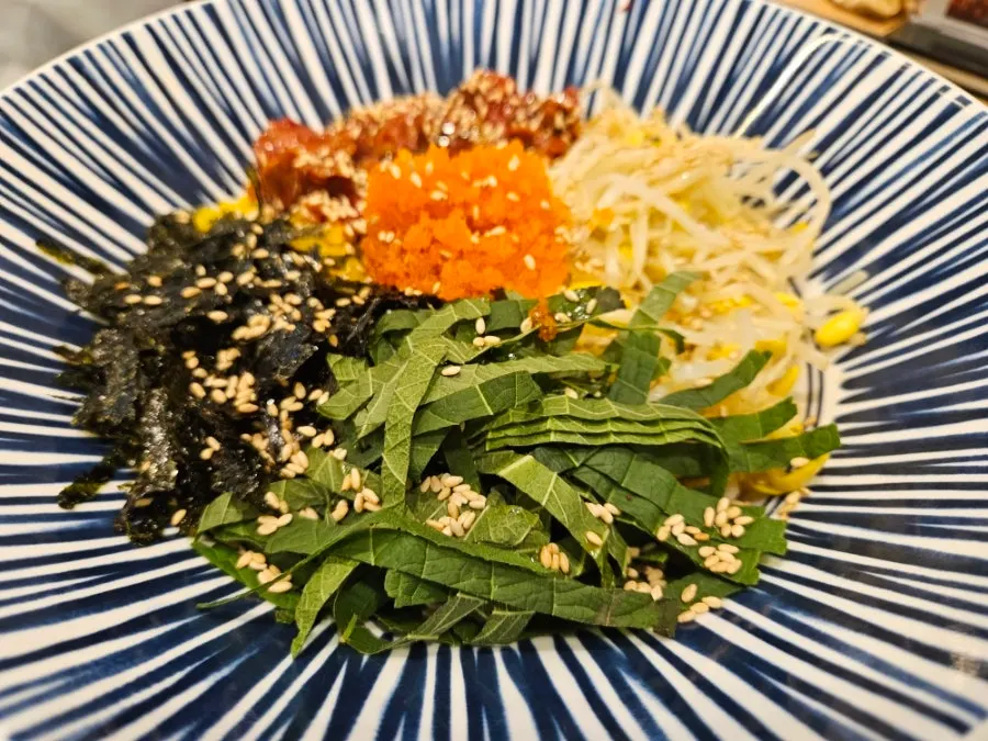 Soy-sauce cockle bibimbap with bean sprouts and cockle meat