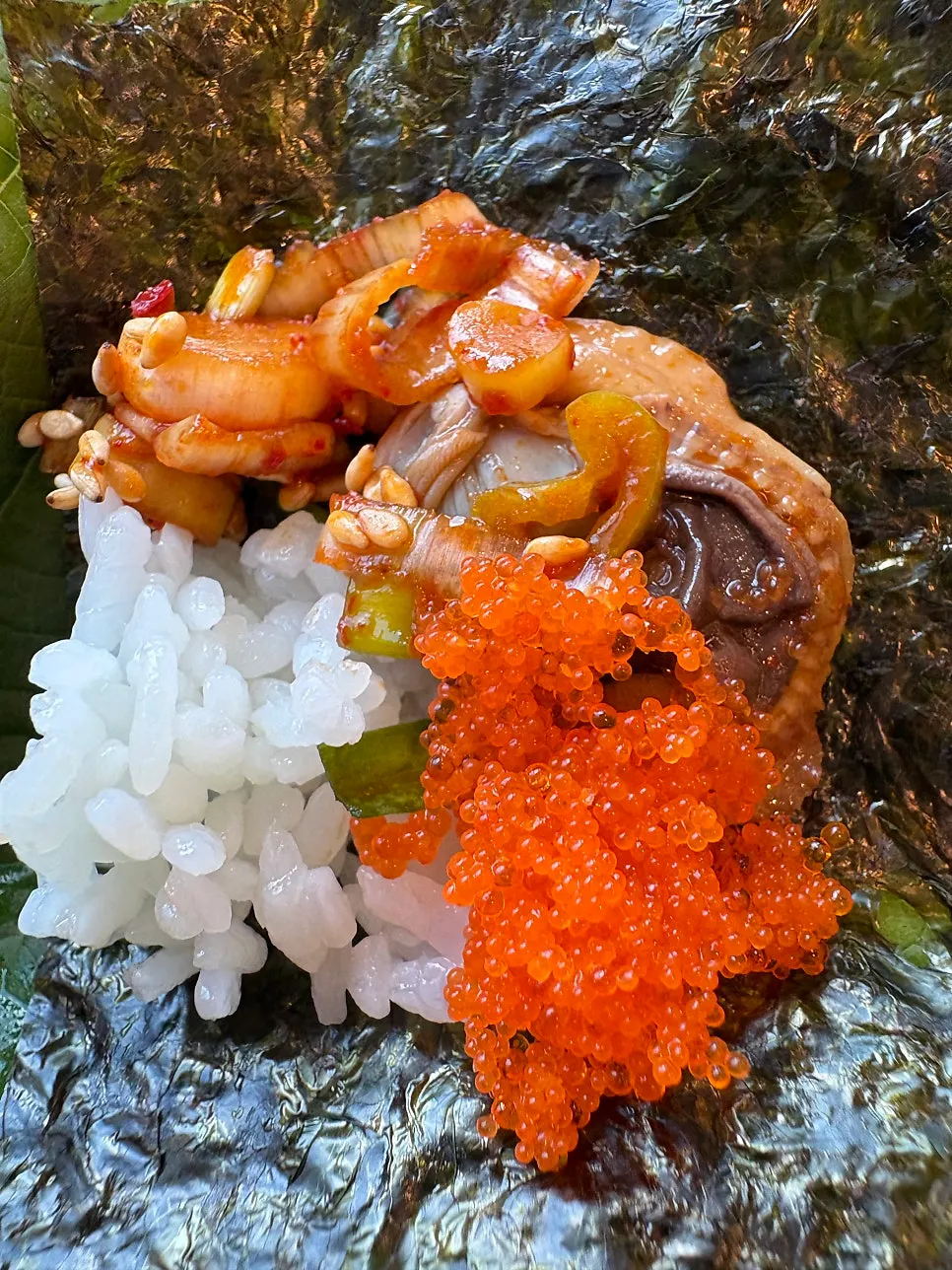 Seasoned cockles and flying fish roe on laver