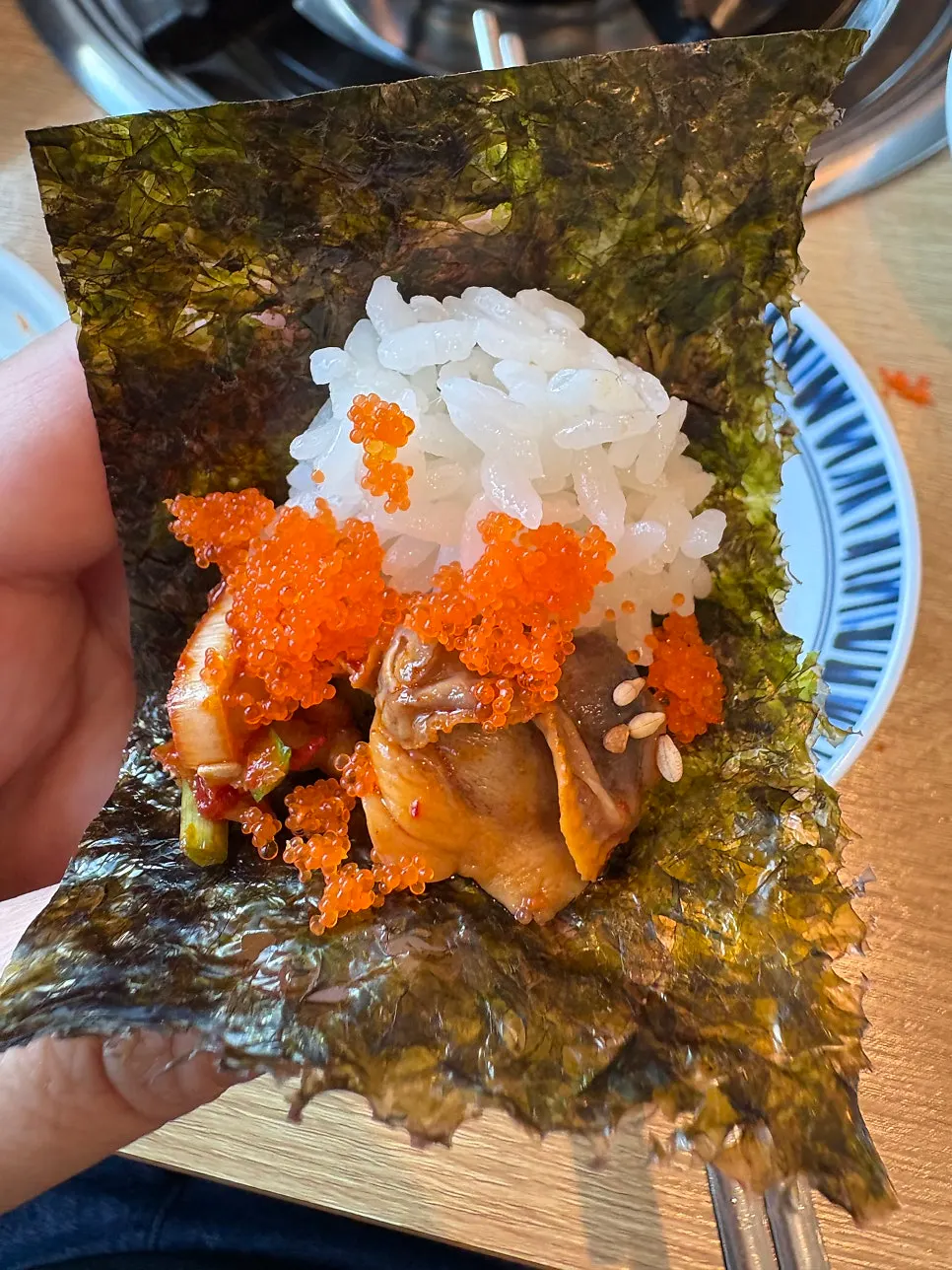 Seasoned cockles wrapped in perilla leaf