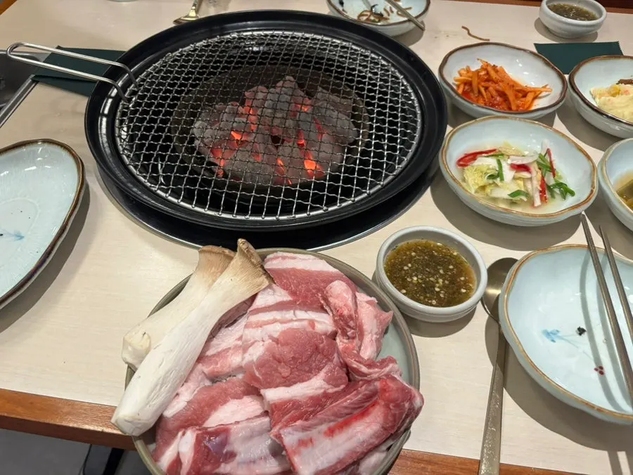 Two servings of raw pork galbi served with mushrooms