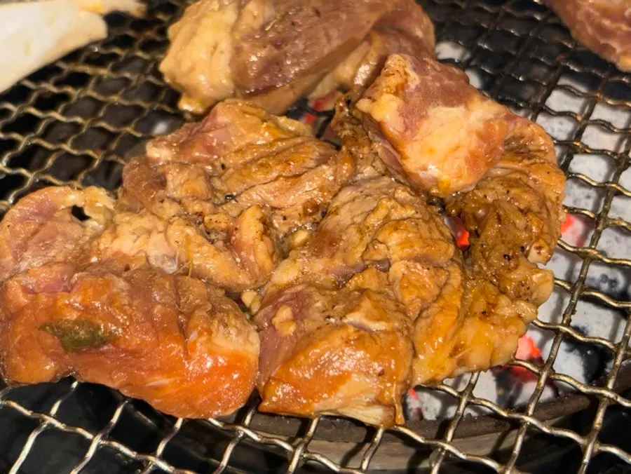 Yuja-marinated pork galbi grilling over charcoal