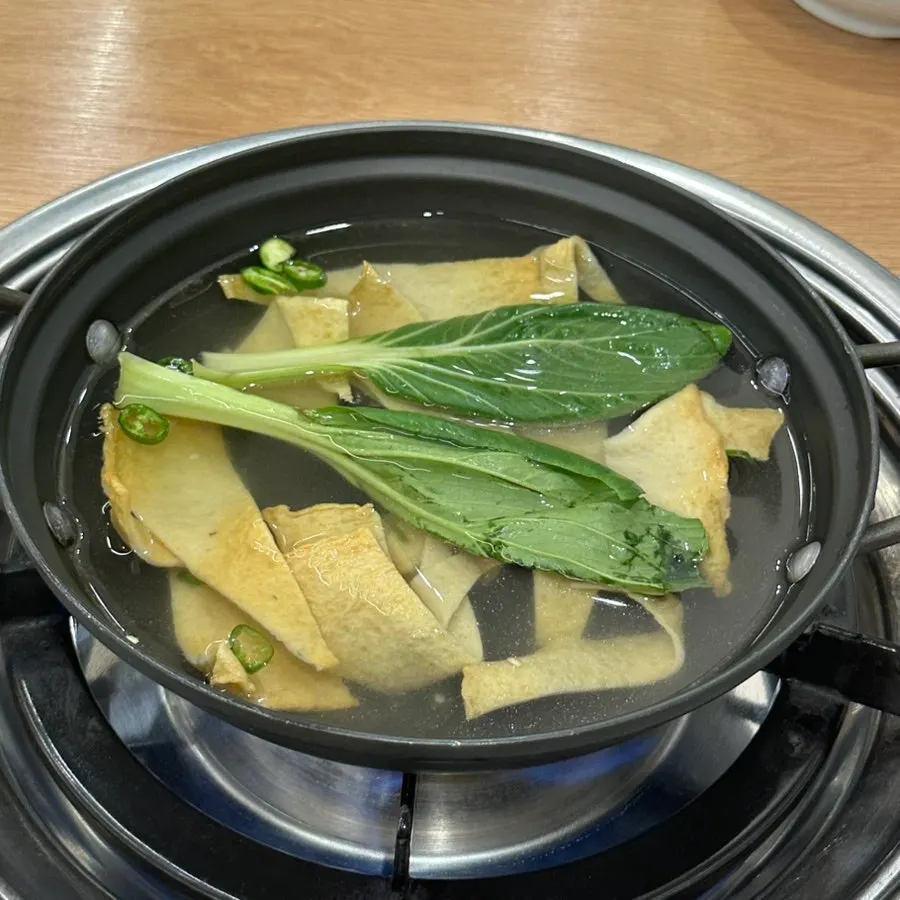 Basic banchan with white kimchi, tofu kimchi, seaweed and perilla leaves