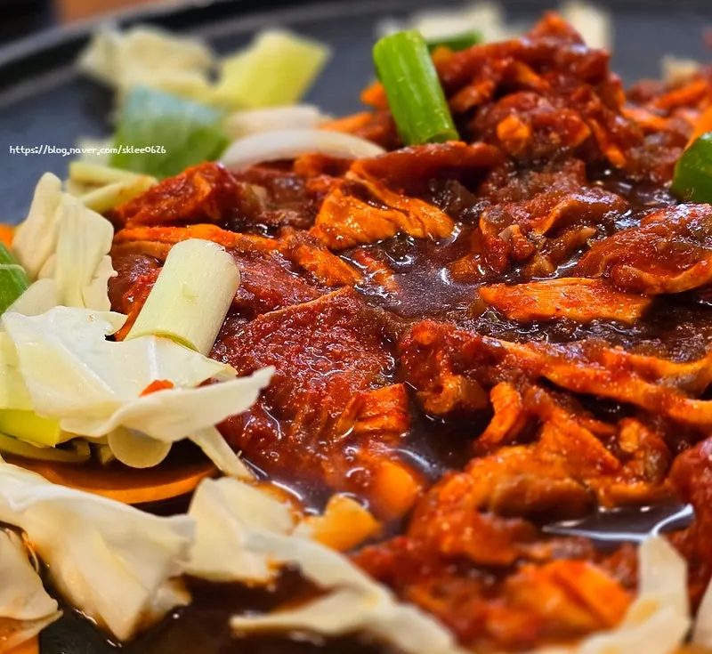 Close-up of gochujang jumulleok covered in sauce