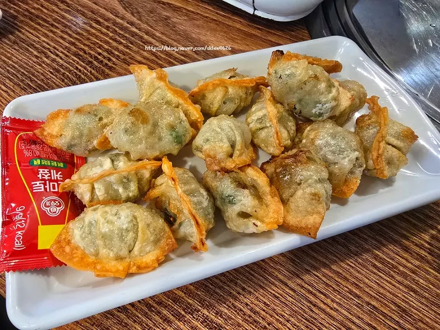 Fried water mandu dipped in shrimp-jang soy sauce
