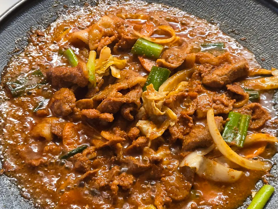 Gochujang jumulleok served on a griddle