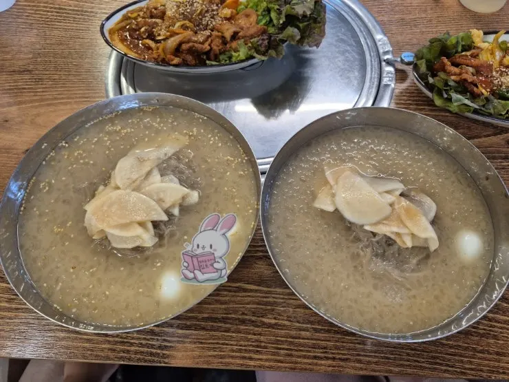 Water-based cold noodles with radish and quail eggs in a slushy broth