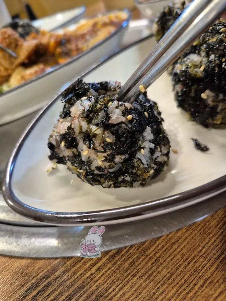 A plate of three large rice balls