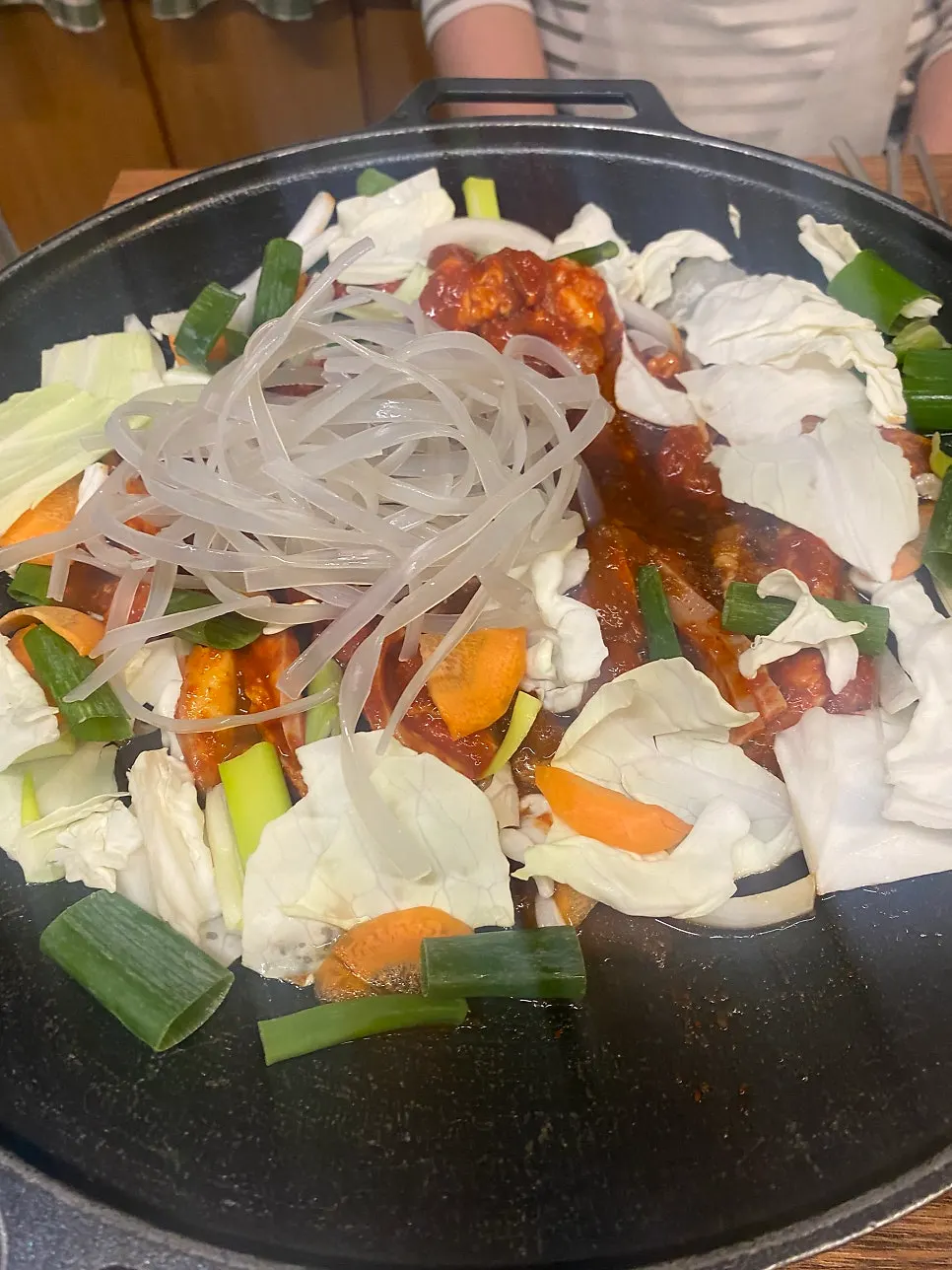 Two servings of jumulleok cooking on the grill