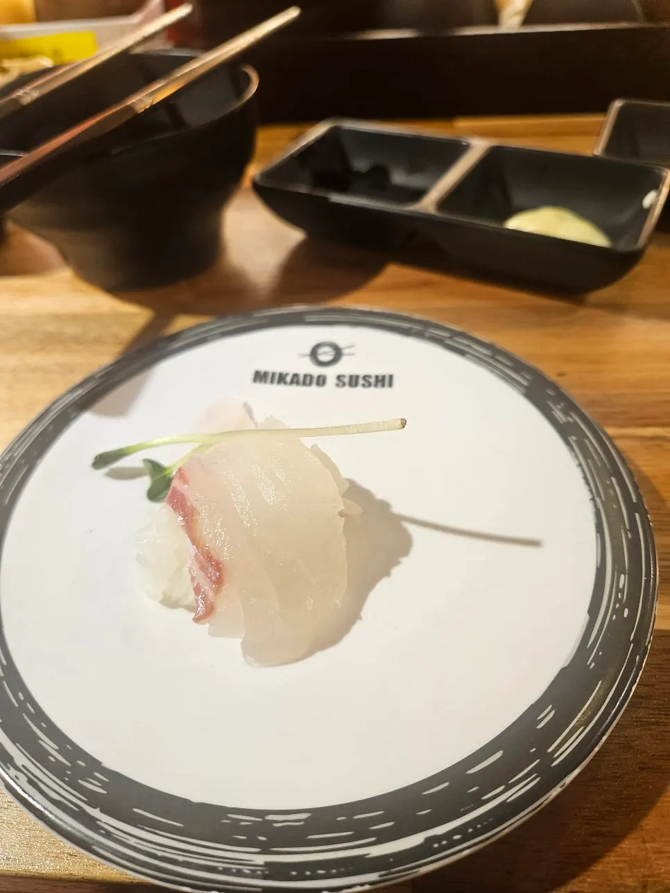Close-up of sushi topped with sauce