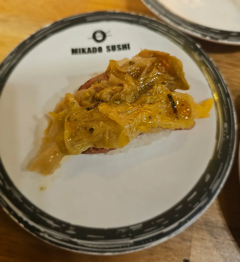 A plate of live fish aged kimchi sushi
