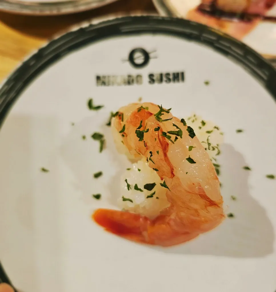 Two pieces of red king shrimp sushi