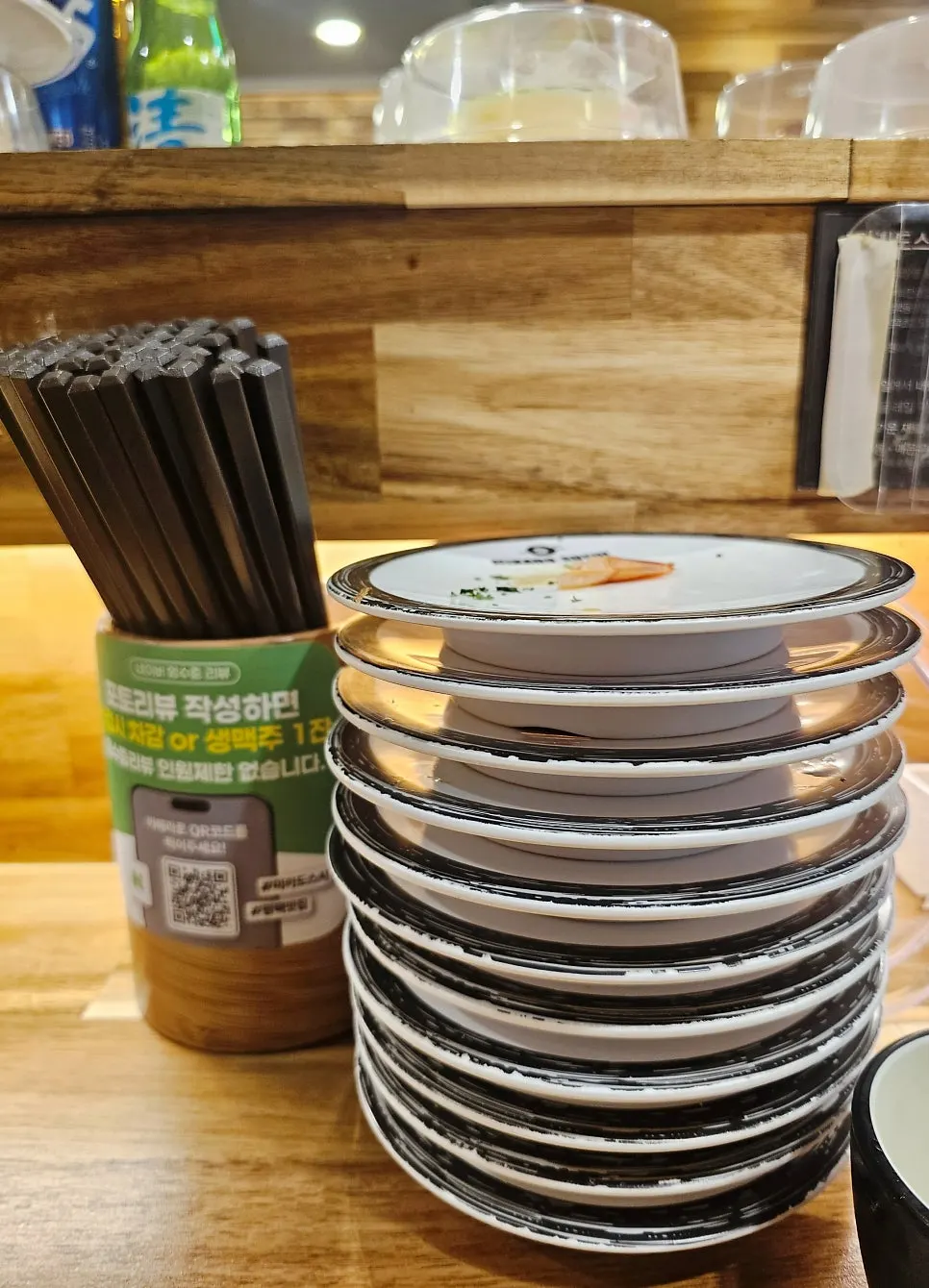 25 plates stacked up after the two of them finished eating