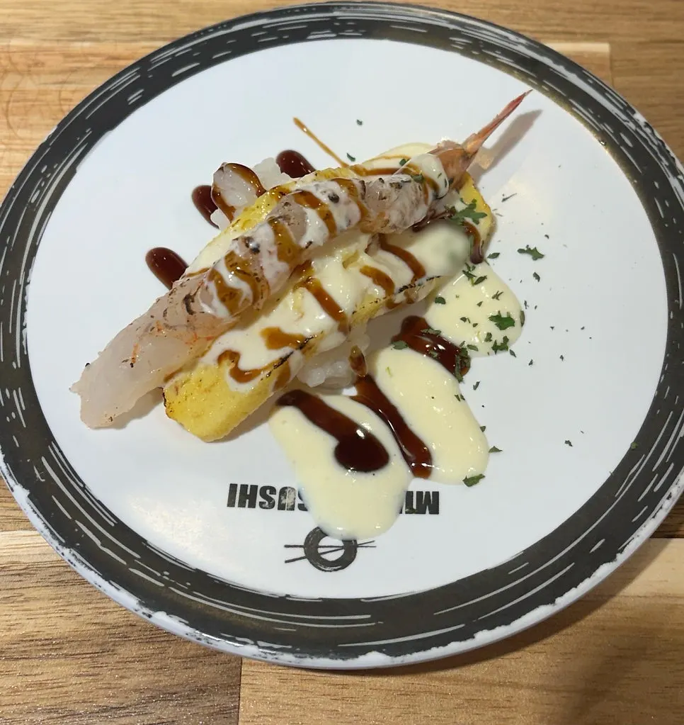 Grilled cheese shrimp sushi with melted cheese on top
