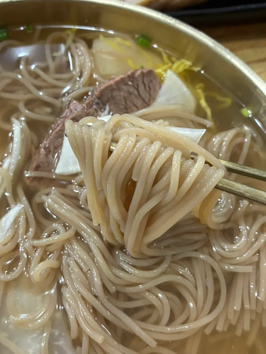 Buckwheat noodles lifted with chopsticks