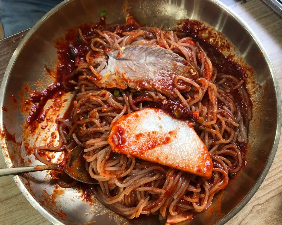 Seoul Myeonok's bibim naengmyeon topped with garnish