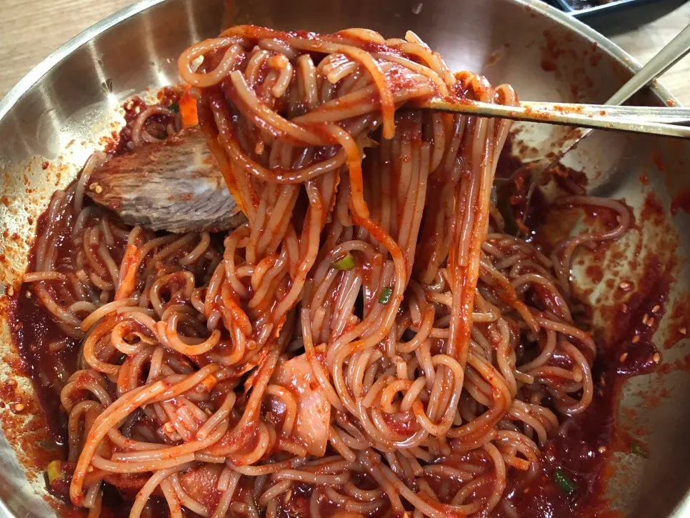 Close-up of well-mixed bibim naengmyeon noodles