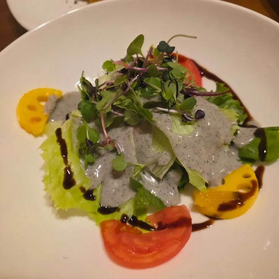 Salad and lotus-root side dishes in a Korean set meal