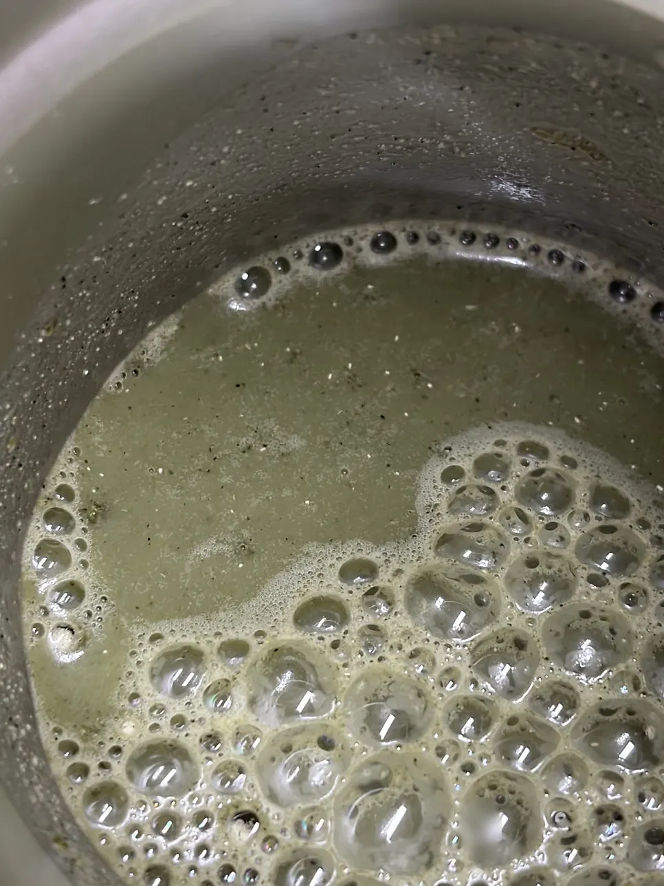Drinking the thick, well-mixed mugwort soy milk