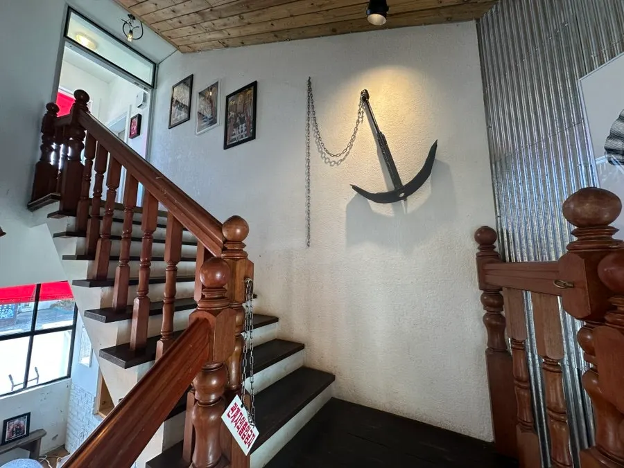 The stairwell wall and second-floor entrance