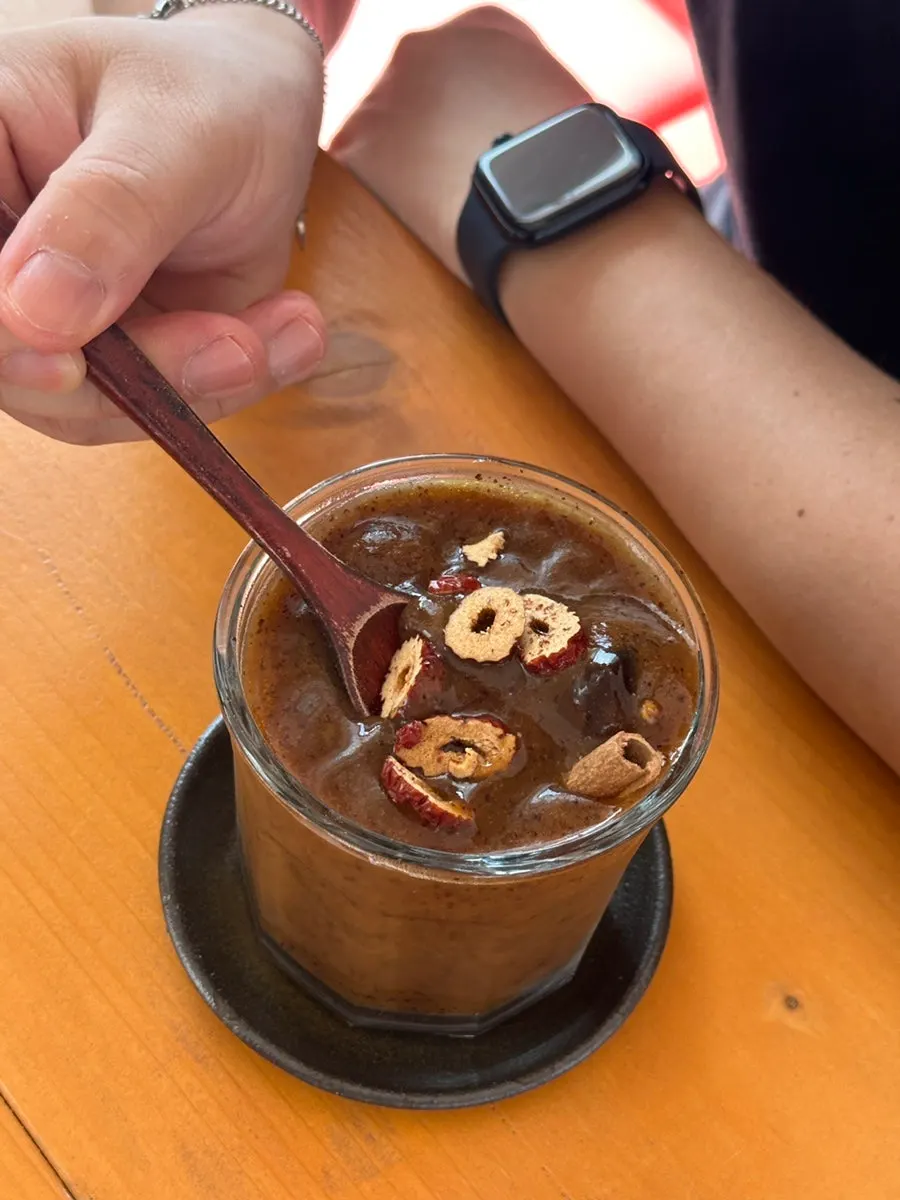 Iced date tea topped with date slices