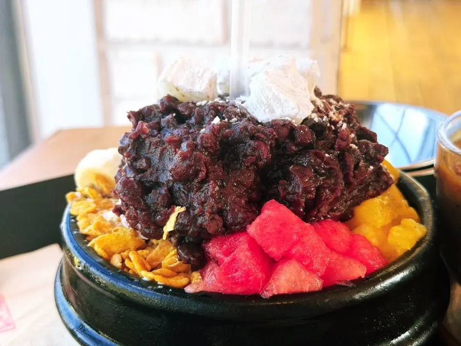Ttukbaegi patbingsu with handmade red bean on top of the ice