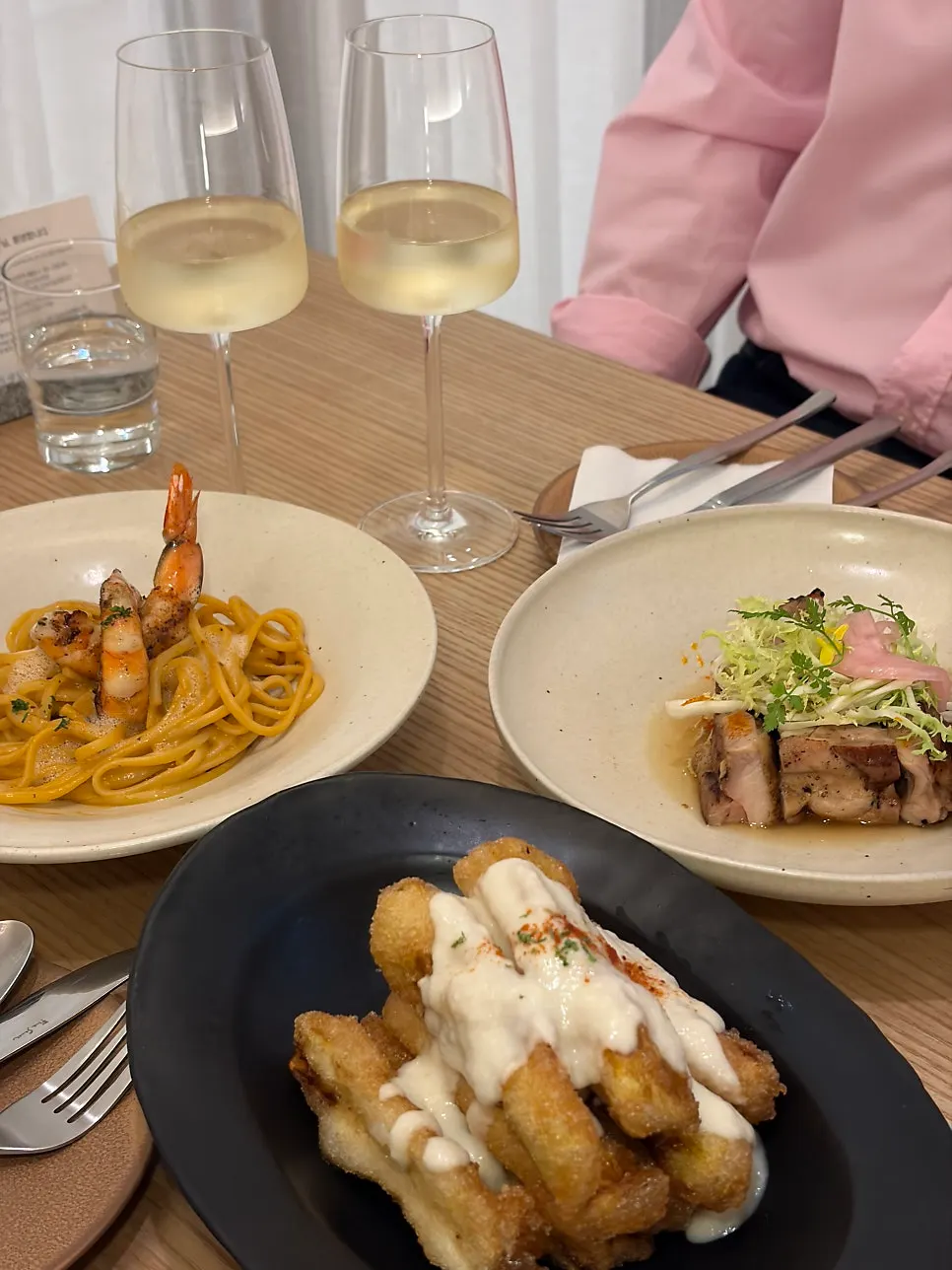 A full spread of dishes and wine